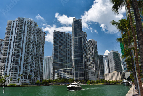 A Luxury Yacht Cruising the Miami River with Brickell and Downtown Skyline