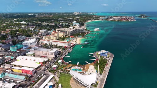 Nassau, Bahamas: Aerial view of turquoise sea, white sand beach and coastal road on New Providence island - landscape panorama of the Caribbean from above
