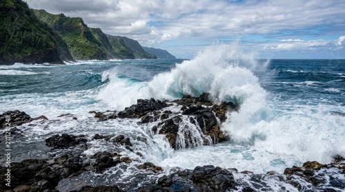 A powerful wave crashes dramatically against a rugged, dark coastline. The ocean roars as it explodes upwards, sending spray and foam high into the air.