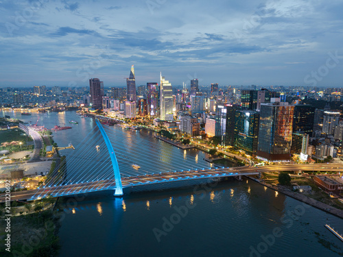 Bild auf Leinwand Aerial Twilight View of Saigon and Ba Son Bridge in Ho Chi Minh City