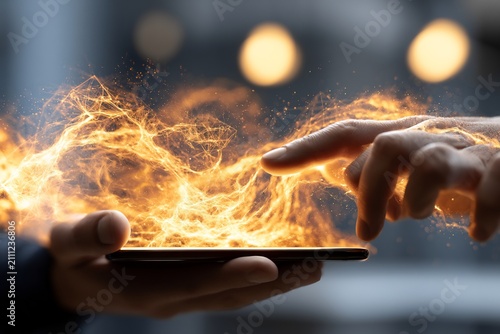 Hands holding a smartphone with fiery energy emerging, symbolizing powerful and fast digital connection and technology.