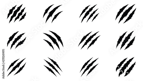 фотографія Set of various wild animal claw scratch mark silhouettes with predator, isolated