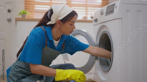 Cleaner woman washing machine glove laundry apron uniform home cleaning appliance, yellow glove door care, cloth loading, housework service in bright laundry room