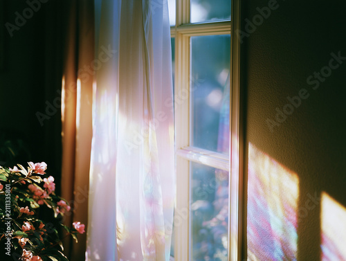 Dreamy Rainbow Light Reflections on an Interior Wall by a Window