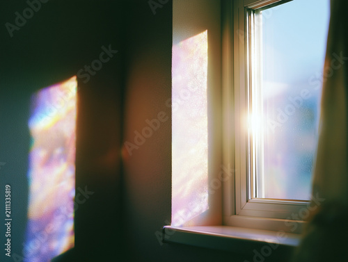 Dreamy Rainbow Light Reflections on an Interior Wall by a Window