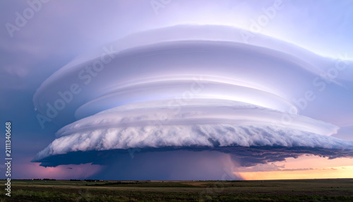 Spectacular Lenticular Cloud Formation Over Rural Landscape at Sunset.