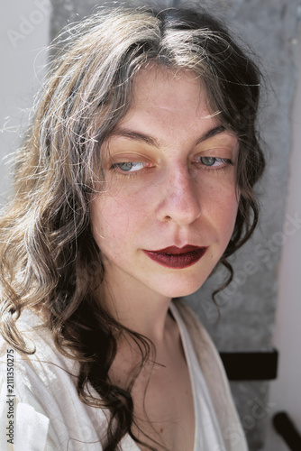 Woman with wavy hair in a studio setting during a photoshoot