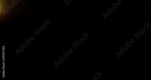 Blue anamorphic lens flare moving overlay in super slow motion featuring cinematic horizontal light streaks, realistic optical reflections and dynamic glow on a black background. Premium VFX asset.