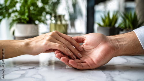 Intimate Connection: A gentle touch between two hands, symbolizing deep connection, trust, and tender affection in a quiet, elegant setting.