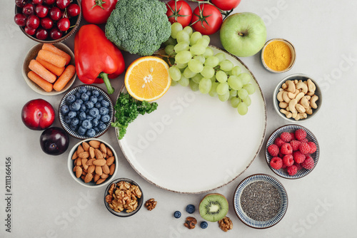 Canvas Print Healthy antioxidant rich foods flat lay on light background with copy space