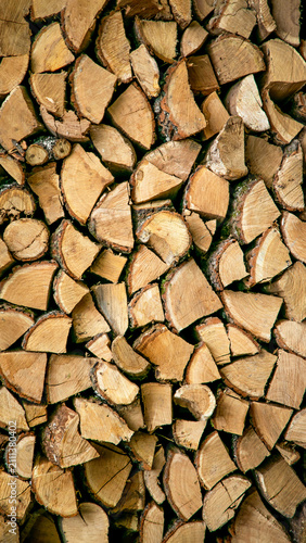 Stacked firewood logging industry background texture