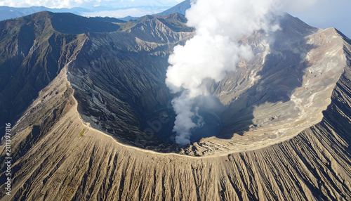 Majestic Volcano Crater Emitting Smoke Against a Clear Sky.