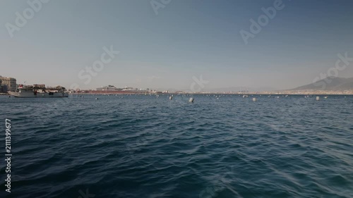 A boat harvesting mussels from a farm in the Gulf of Naples along the Mediterranean coast.