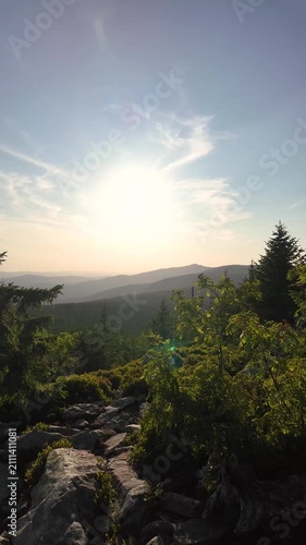 Sunset panorama from the Himmelsleiter on Mount Lusen overlooking the Bavarian Forest in golden summer light