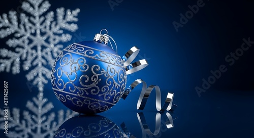 Blue Christmas ornament with snowflake. Festive holiday bauble on dark background.