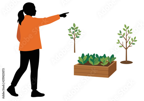 Schilderij op canvas A silhouetted woman points to a revitalized urban vacant lot with newly planted greenery
