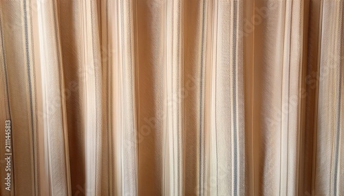 A Smooth Abstract Patterned Backdrop With Faded Vertical Stripes In Warm Beige And Light Brown Hues Evoking Woven Fabric