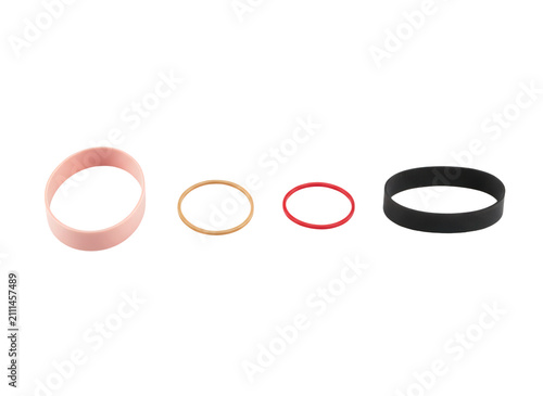 Quadro su tela Four different colorful elastic rubber bands arranged in a row