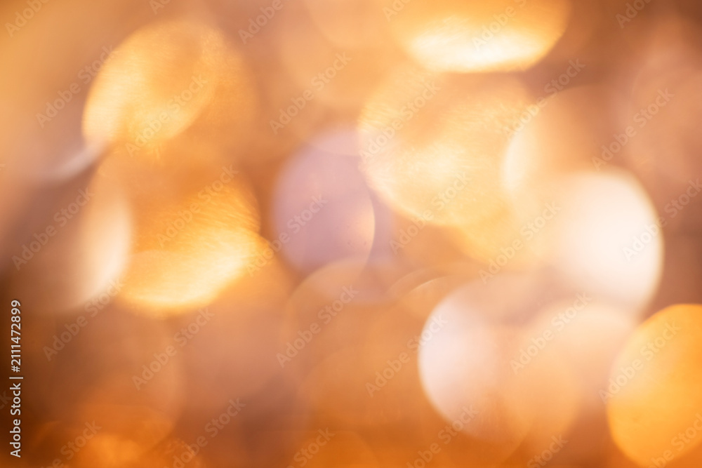 Fototapeta premium Golden glitter bokeh with warm light spots, festive