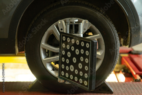 Wheel alignment target mounted on car tire