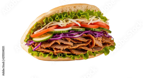 Perfectly assembled doner kebab with grilled meat and fresh vegetables in pita bread on a wooden board against a warm background. Delicious street food concept