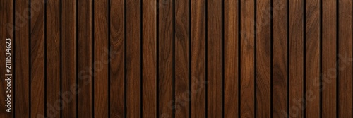 Dark walnut wood slat wall texture, vertical timber paneling background for interior design, elegant brown wooden lath surface, architectural wood cladding backdrop for luxury decor