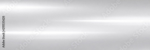 Brushed silver metal texture with horizontal light reflections, polished aluminum surface background, sleek metallic steel finish for industrial design and modern technology backdrops