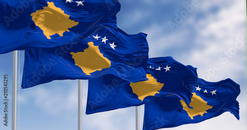 Kosovo national flags waving on a clear day