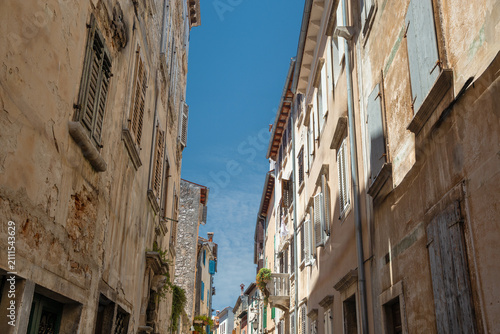 Narrow historic street in old town Rovinj, Istria, Croatia.