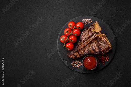 T-bone steak, beef meat grilled until done rare with salt and spices. T-bone steak