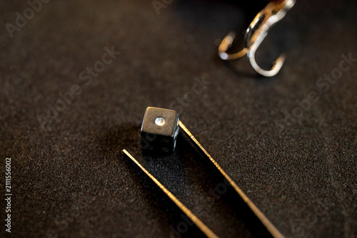 Fotografie Dark moody setting focusing on a tiny object symbolizing exact chance and strate