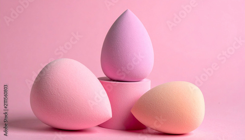 Professional makeup sponges on pink pedestal still life photography