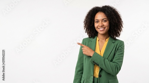 Independência do brasil Smiling businesswoman in green suit pointing to the left with copy space on white background