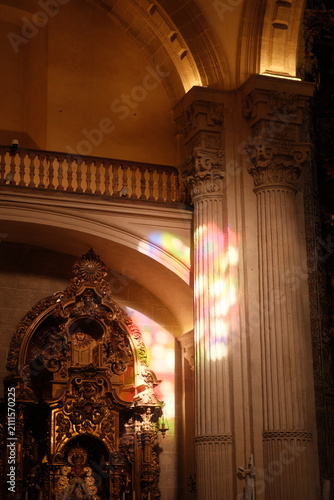 beautiful stained glass colorful light reflecting inside seville cathedral, the largest Gothic cathedral in the world