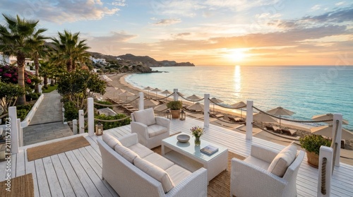 Luxury oceanfront house terrace overlooking a beautiful sunset at a tropical beach resort