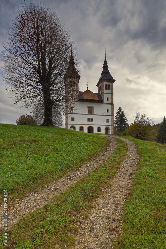 Fototapeta premium St.Volbenka in Logu parish church, Renaissance-Baroque from 1660-90 with two bell towers, their onion domes remade in 2006. Skofja Loka-Slovenia-166