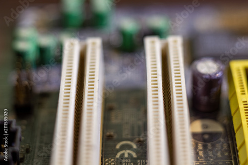 Fotografie Motherboard expansion slots for graphics cards and hardware components on printe
