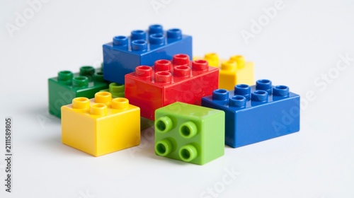Pile of colorful plastic toy building blocks isolated on white background