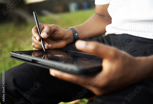 A person using an electronic tablet