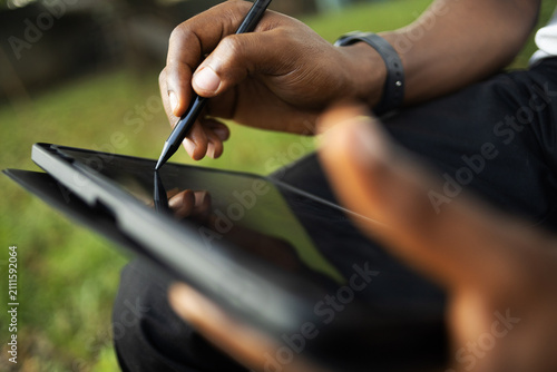 A person using an electronic tablet