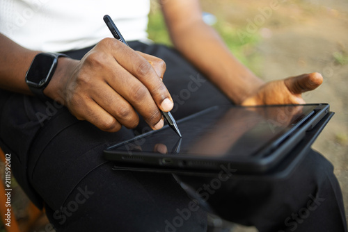 A person using an electronic tablet