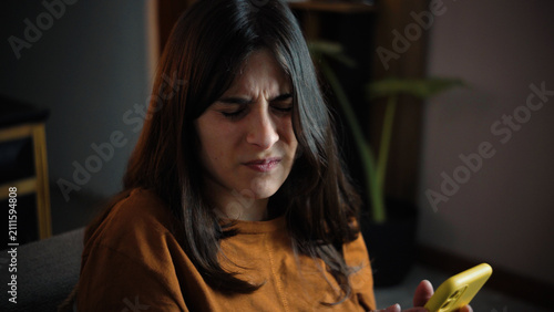 фотографія Young Latina woman at home experiencing severe digital eye strain and headache f