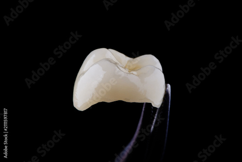 High-quality zirconia dental crown on white background. Dental ceramic crown professional dental lab
