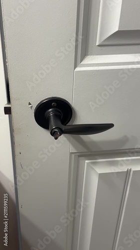 Close-Up Video of a Residential Bathroom Door Handle Inside a Modern Home Interior