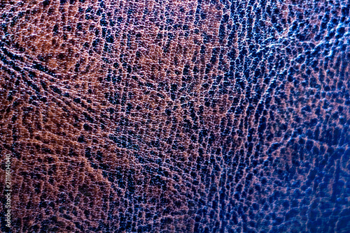 фотографія Brown textured leather surface with natural grain pattern and deep wrinkles for
