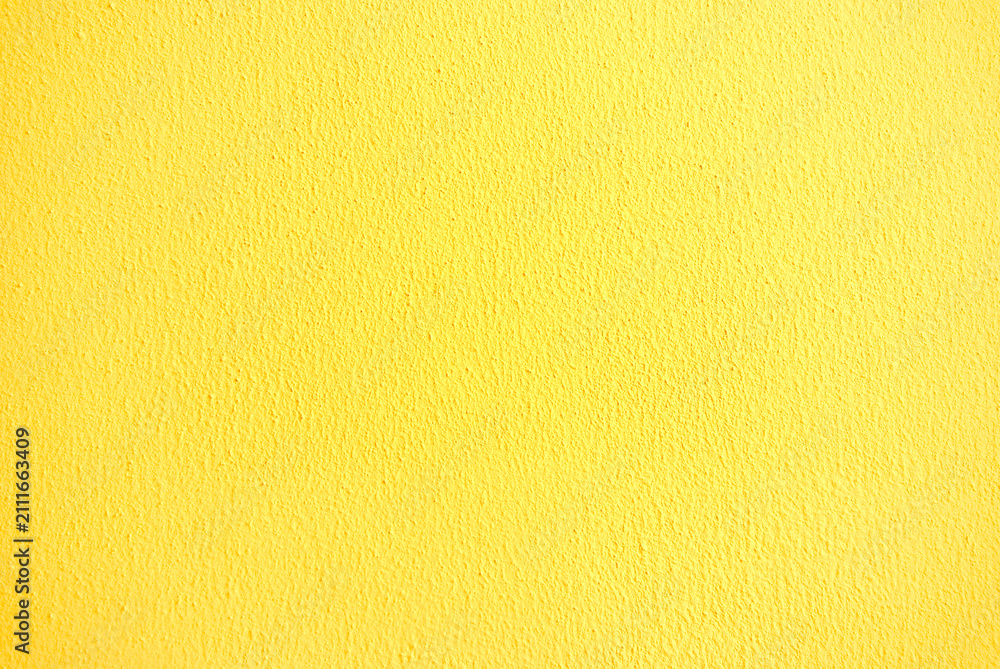 Naklejka premium Yellow stucco wall texture background with fine plaster surface