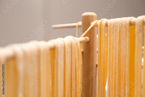 Foto Fettuccini homemade pasta hanging from a pasta tree