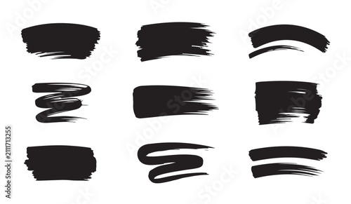 Rough black paint brush strokes collection with abstract swashes and dry ink textures for art projects.