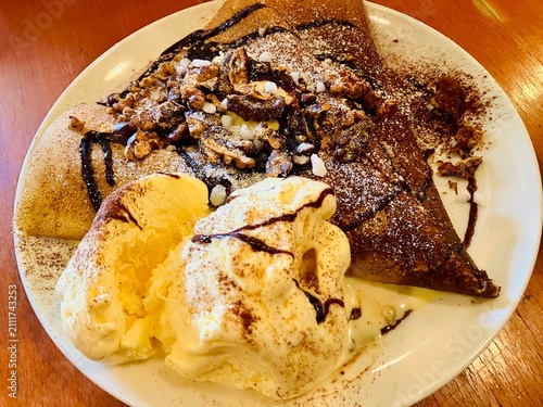 Crepes with chocolate, walnuts and vanilla ice cream