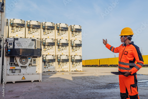 Industrial Engineer Inspecting Refrigerated Shipping Containers for Cold Chain Logistics and Temperature Control